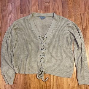beige sweater in a small/medium